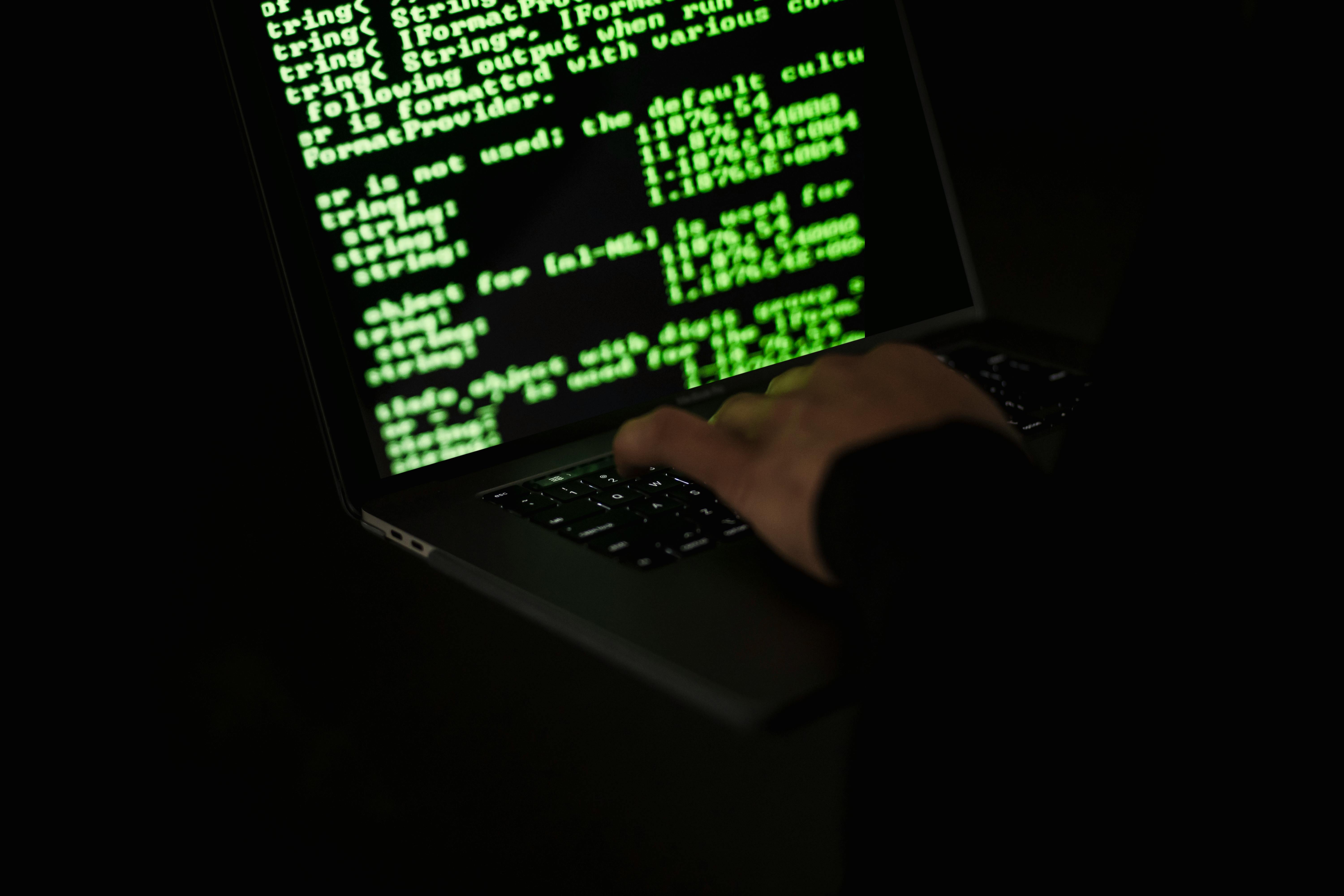 Network security analyst reviewing code